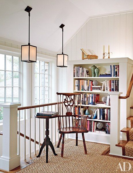 In a Hamptons home renovated by architect Andrew Pollock and furnished by Cullman & Kravis, a new stair landing created space for a reading nook. The elmwood comb-back Windsor chair dates from the 1780s, and the candlestick table is from the late 19th century. The sisal carpet and runner are from Beauvais. Top Of Stairs Landing Decor, Top Of Stairs Landing, Stairs Landing Decor, Landing Decor, Top Of Stairs, Stair Landing, Hamptons House, Cozy Reading Nook, Sisal Rug