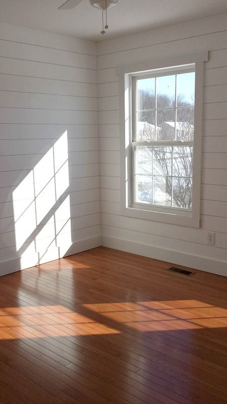 Faux shiplap walls with simple window trim and wood floors. Thinking about this for the living room. Simple Window Trim, Wood Paneling Living Room, Small Bedroom Makeover, White Wood Paneling, Shiplap Paneling, Living Room Wood Floor, White Wood Floors, White Wood Wall, Ship Lap