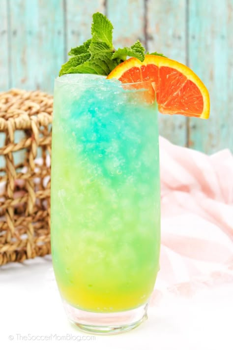 With colorful layers like ocean waves and tropical fruit flavors, this Blue Lagoon Cocktail is as refreshing as a summer breeze! Lake Water Cocktail, Colorful Vodka Cocktails, Blue Ocean Cocktail, Moana Cocktail, Layered Cocktails Recipes, Blue Lagoon Drink Recipe, Blue Lagoon Drink, Malibu Cocktail, Curacao Cocktail