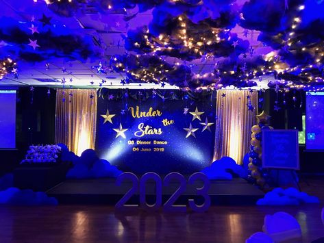 Decorations for the 8th grade dinner dance with a Under The Stars theme. The beautiful handmade party decoration & celebrating the milestone. School Formal Theme Ideas, Under The Start Theme, Galaxy Dance Theme, Blue And Gold Prom Decorations, Under The Stars School Dance, Hoco Dance Themes Ideas, Starry Night Prom Centerpieces, Themes For Dances, Evening Under The Stars Theme