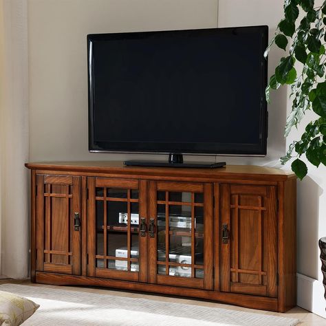 Color: Mission Oak Brand: Leick Home Size: 60-inch This console holds TVs up to 60" with a 260 lb. weight bearing capacity. It includes hardwood solids and veneers in a hand applied Mission Oak finish. The adjustable component shelves sit behind beveled and tempered glass door with blackened mission pull hardware. Each end comes with adjustable shelves! Oak Corner Tv Stand, Corner Tv Console, Wall Entertainment Center, Oak Tv Stand, Living Room Entertainment Center, Floating Tv Stand, Corner Tv Stand, Solid Wood Tv Stand, Mission Oak