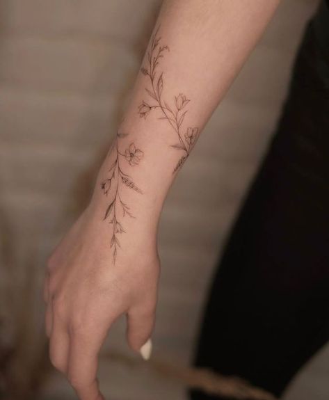 Vine Flower Arm Tattoo, Small Wrist Wrap Tattoos, Flower Cuff Tattoo Forearm, Dainty Arm Wrap Tattoos For Women, Arm Rap Tattoo, Classy Ankle Tattoo, Botanical Wrist Wrap Tattoo, Wrapped Tattoo Arm, Bracelet Tattoos For Women Arm