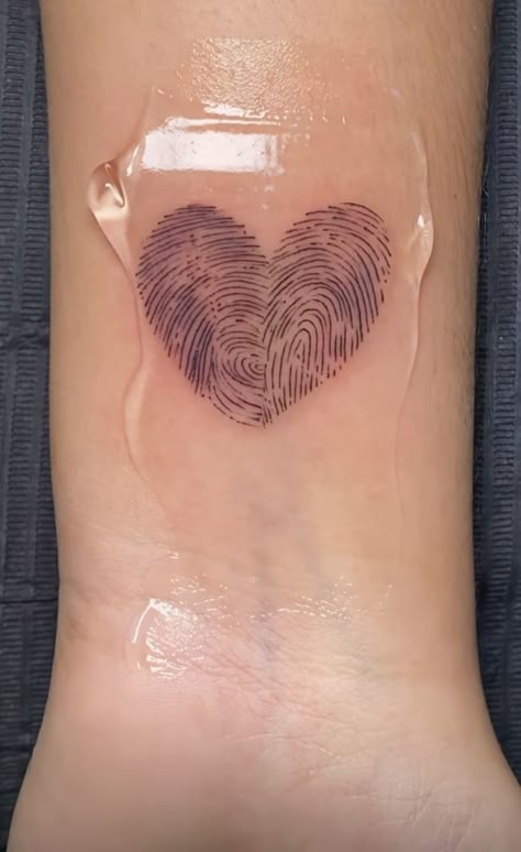 Heart Shape Fingerprint Tattoo, Tattoo Ideas To Get For Your Girlfriend, Two Fingerprints Heart Tattoo, Tattoo Heart Fingerprint, Two Thumb Print Heart Tattoo, Couple Thumb Print Tattoo, Finger Print Heart Tattoo Couple, Couples Thumbprint Heart Tattoo, Parent Fingerprint Tattoo