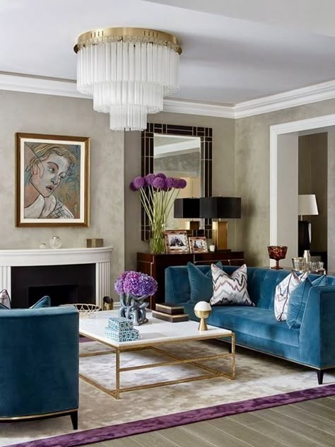 BEAUTIFUL ART DECO HOME DECOR IDEAS by Lifestyle and Home Decor Blogger Laura Lily, blue velvet couch, art deco design, tiered chandelier, art deco mirror, marble and gold coffee table, purple cream rug, art deco design, art deco inspired, geometric mirror, art deco mantel, Salon Art Deco, Teal Living Room Decor, Black Couch, Teal Living Rooms, Art Deco Living Room, Couch Decor, Trendy Living Rooms, Room Black, Interior Deco