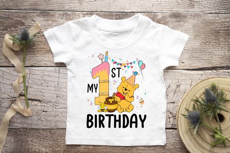 About Winnie The Pooh Birthday Shirt, My 1st Birthday, Pooh Bear, Happy Birthday Shirt: You will love our comfort T-shirt once you put them on and experience a perfect combination of softness and stretchiness. Each comfort T-shirt is constructed with 100% preshrunk combed ring spun cotton, 30 singles to give you freedom of movement no matter what you’re doing. Perfect Design: Semi-fitted. High stitch density for smoother printing surface. 3/4" non-topstitched collar, taped neck ... First Birthday Winnie The Pooh, Winnie The Pooh Happy Birthday, Pooh Happy Birthday, Birthday Winnie The Pooh, Bear Happy Birthday, Baby First Birthday Themes, Happy Birthday Shirt, Pooh Birthday, Winnie The Pooh Birthday