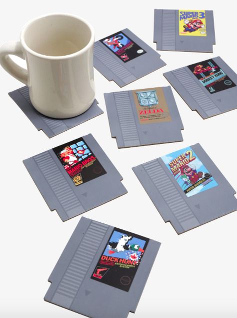 A set of <a href="http://www.anrdoezrs.net/links/8209452/type/dlg/sid/SHOPGGdadwhohaseverythingLilly531184821467/https://www.boxlunch.com/product/nintendo-nes-cartridge-coasters/11338577.html?" target="_blank" data-skimlinks-tracking='4821467'>NES coasters</a> so he can wax poetic about his OG standbys without compromising the coffee table finish. Geek Home Decor, Nes Cartridge, Nerd Room, Video Game Rooms, Geek Decor, Nintendo Nes, Gamer Room, Video Game Room, Donkey Kong