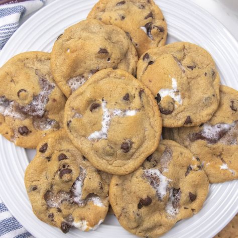 S'mores stuffed cookies are a loaded chocolate chip cookie. Loaded with graham cracker, chocolate and marshmallows in each bite! Give these cookies a try soon! #passion4savings #cookies #smores #stuffed #chocolatechip #marshmallows #grahamcracker S'mores Chocolate Chip Cookies, S’mores Chocolate Chip Cookies Easy, Graham Cracker Chocolate Chip Cookies, S’more Chocolate Chip Cookies, S’mores Chocolate Chip Cookies, Smores Chocolate Chip Cookies, Cookies Smores, Smores Cookies Recipes, Cracker Chocolate