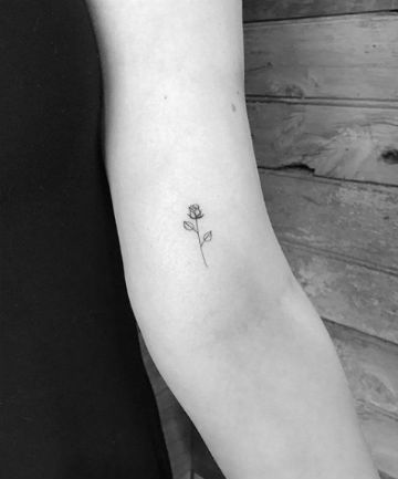 Tiny But Mighty Rose Tattoo Tiny Rose Tattoo Simple, Rose Rib Tattoos, Rose Bud Tattoo, Simple Rose Tattoo, Yellow Rose Tattoos, White Rose Tattoos, Small Rose Tattoo, Rose Tattoos For Women, Small Girl Tattoos