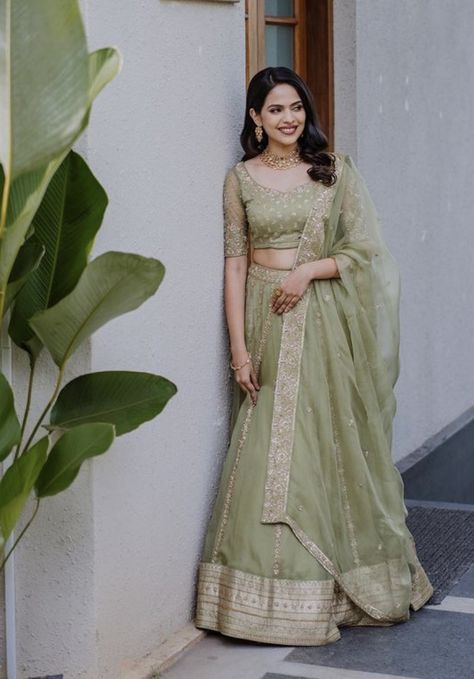 WhatsApp on 9496803123 to customise your handcrafted designer bridal wear with us online. Book your appointment today. We do ship internationally. (Pics for reference) Pastel Green Lehenga Bridal, Pastel Green Lehenga Combinations, Green Lehenga Outfit, Saree Gowns Dresses Indian, Halfsarees Traditional, Light Saree, Mehandi Outfit, Mehendi Dress, Mehandi Outfits