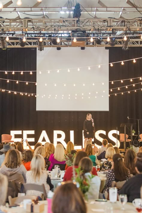 woman speaks on stage with FEARLESS sign behind her | Tennessee Women Connect Live Event at the Loveless Barn photographed by Nashville TN branding photographer Amy Allmand Photography. #AmyAllmandPhotography #TennesseeWomenConnect #NetworkingEvent Speak On Stage, Women In Leadership Photography, Women Events Ideas, Woman On Stage Speaking, Leadership Aesthetic Photography, Panel Speaking Aesthetic, Women Speaking On Stage, Woman Evolve Conference, Female Speaker On Stage