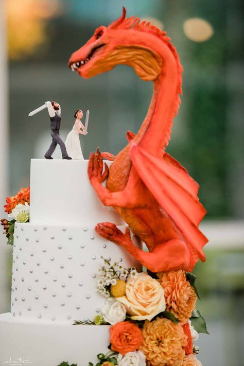 Orange dragon fantasy wedding cake with peach and orange flowers at Chihuly Glass House | Flora Nova Design Seattle Fantasy Wedding Cake Topper, Dragon Wedding Cake Topper, Princess Bride Wedding Cake, Dragon Age Wedding, Mystical Wedding Cake, Fantasy Wedding Cake Ideas, Dragon Wedding Decor, Pokémon Wedding Cake, Wedding Ideas Cottagecore