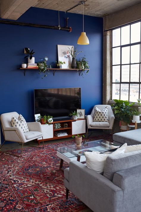 Warm Industrial Knoxville Rental Apartment Tour | Apartment Therapy Cobalt Blue Walls Living Room, Blue Wall Interior Living Room, Accent Wall Blue Living Room, Cobalt Blue Home Decor, Cobalt Blue Interior Design, Cobalt Blue Accent Wall, Cobalt Blue Interior, Blue Wall Apartment, Cobalt Blue Room