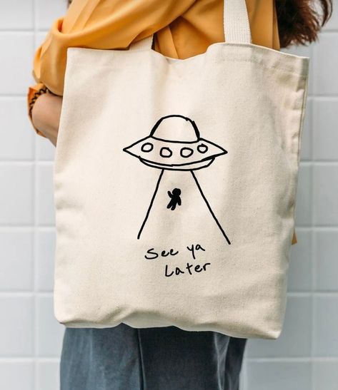 See Ya Later Tote Bag Tote Bag Designs Paint, Canvas Bag Painting Ideas Easy, Drawing On Bags Ideas, Tote Bag Diy Design, Tote Bag Diy Paint, Painted Tote Bag Aesthetic, Tote Bag Ideas Design, Desain Tote Bag Simple, Tote Bag Drawing Ideas