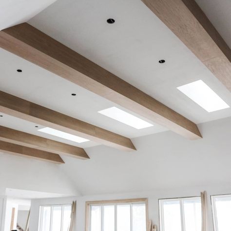 We love how these wooden beams turned out..The perfect way to fill out 14ft tall ceilings! Modern Beamed Ceiling, Wooden Beams Lighting, Beams On Textured Ceiling, Ceiling Beams Basement, Light Beams Ceiling, Wooden Beams Flat Ceiling, Slanted Ceiling Wood Beams, Wood Beams On Angled Ceiling, Raked Ceiling Living Room Wood Beams