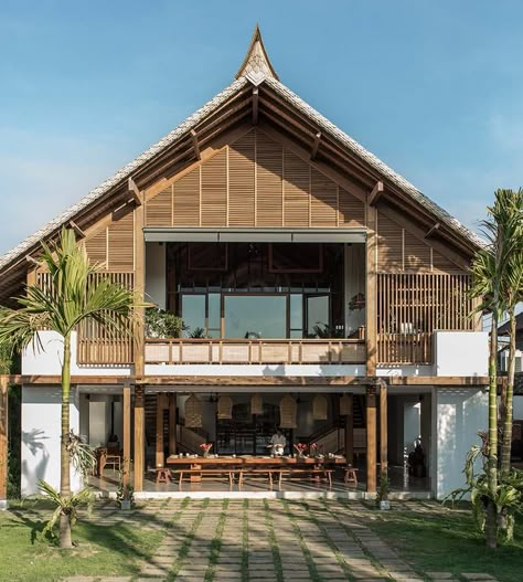 This is a look at the back of the house with a large open balcony at the upper level directly above the dining area. Traditional Filipino Architecture, Open Balcony, Bali Jungle, Tropical Trees, Bali House, Tropical Architecture, Rest House, Industrial Development, Architectural Design House Plans