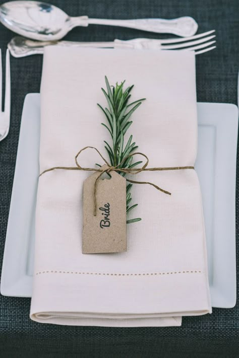 Rosemary accented wedding place name setting attached with DIY tag Wedding Name Tags, Place Card Table Wedding, Wedding Place Names, Rustic Wedding Decorations, Table Place Cards, בר מצווה, Wedding Name, Wedding Table Decorations, Wedding Table Settings