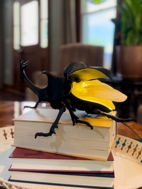 Illuminate your space with this quirky and playful Rhino Beetle Lamp. Made with precision using 3D printing technology, this lamp is a unique addition to any room. Choose from black or champagne gold for the perfect match to your decor. Perfect for bug enthusiasts or anyone looking for a fun and unusual lighting option Insect Home Decor, 3d Printed Aesthetic, Bug Room Decor, Trending Lamps, Eccentric Home Decor, Bug Bedroom, Weird Room Decor, Fun Things To Buy, Lighting Ideas Bedroom