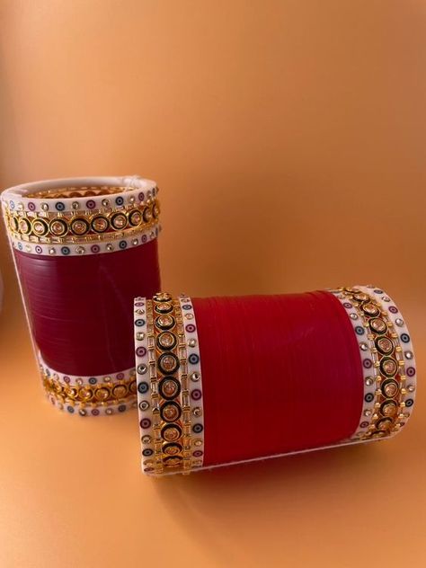 Available in sizes 2.4, 2.6, and 2.8. All of our chura sets come in a gold box and have never been worn or tried on. Free Shipping #churi #indian #bangladesh #usa #bangle #traditional Traditional Chooda Punjabi Bride, Red Choora Designs, Dark Red Choora, Chooda Designs Punjabi, Choda Design, Chura Designs Bridal, Chura Bridal Punjabi Bride, Chooda Designs Brides, Choora Designs