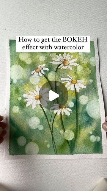 Watercolor Arist | Bree Copley on Instagram: "Love the feel the bokeh effect gives these watercolor daisies ! This technique is really simple and easy to achieve if you have the right tools. be sure to SAVE  for later and SHARE with all your watercolor friends!   Here are the supplies you will need to help you achieve this Bokeh effect.  -masking fluid  -circle stencil  -magic eraser ( the kind you use for cleaning) You can also use a natural sea sponge.  -paper towels  HELPFUL TIPS - you can use any color for the background , so choose more than one.  - when using multiple  colors try not to manipulate the colors or blend them together too much. You don’t want the paint to end up muddy  - be gently with the sponge , rubbing too hard can ruin your paper  -you can also add color washes to y Bokeh Effect Watercolor, Watercolour Masking Fluid, Watercolor Bokeh Tutorial, Watercolor Pouring Technique, Simple Watercolour Ideas, Unique Watercolor Paintings Ideas, Watercolor Videos Tutorial, Watercolor Background Tutorial, Watercolor Friends