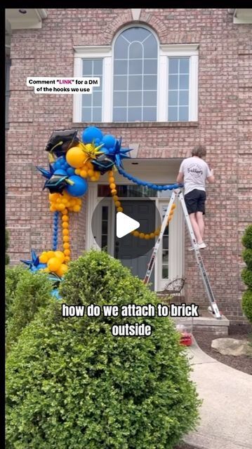 POP POP BALLOON on Instagram: "Here is a little “how to” for attaching balloon decorations to outdoor brick. . ✨comment “link” for a DM of the hooks and other products we use in our business ✨ . These chains balloons were super light so we didn’t need to worry about reinforcing anything. But if you are going to be adding a big balloon garland make sure to use gaff tape around your hook!  . Hope this helps with all your grad decorations!  . #poppopballoonfw #fortwayneballoons #chainballoons #linkballoons #linkaloons #graduationballoons #gradddecor #gradparty #balloontips" Balloon Garland Outside House, Balloon Garland Around Doorway, Front Porch Balloon Decor, Balloon Garland On Brick Wall, Balloon Garland Front Door, Balloon Link Garland, Link Balloons Ideas, Link Balloons Decoration, Outdoor Balloon Decorations