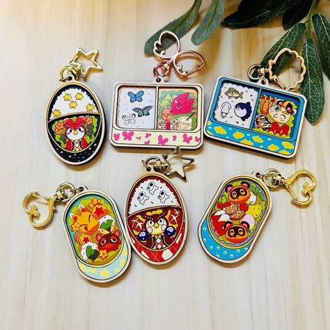 I had these designs for years as acrylic charms but I figure it’s an about time for an upgrade! I love wooden charms so much! Especially animal crossing. They are over in my shop now! #animalcrossing #animalcrossingnewhorizons #bentobox #cuteartwork #cuteartistclub #cuteart #smallbusiness #smallbusinesssupport #etsyshop #etsyseller #woodencharms Oc Keychain Design, Art Merchandise Ideas, Cute Shop Ideas, Animal Crossing Merch, Artist Alley Booth, Keychain Business, Alley Ideas, Sticker Keychain, Cool Keychain