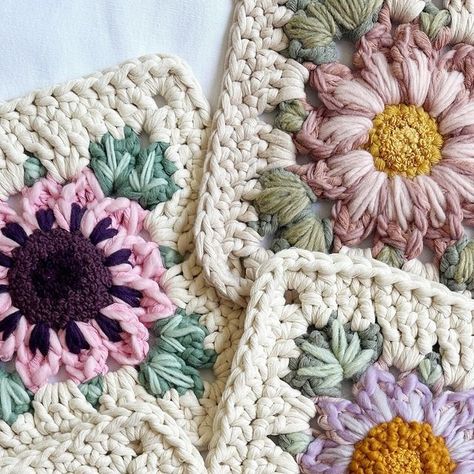 Caroline Langford - Floral Fiber Artist on Instagram: "5 Forever Flower embroidered squares - which is your favorite? 🤩

Each of these are my “Forever Flower” granny square design in 5 mm cotton string, and then I embroidered details with a variety of cotton and wool yarns. I’ll be attaching each of these to dowels so they’ll be ready to bring some flower joy to your homes! 🌸

Love always,
Caroline

#thehappyhomecollective #foreverflowers  #flowerweaving #etsyshop #crochetersofinstagram #floralgrannysquare #flowercrochet #ihavethisthingwithflowers #crochetinspiration #craftinspiration #crochetpattern #bigcrochet" Flower Granny Square Blanket, Floral Granny Square, Daisy Theme, Forever Flower, Flower Granny Square, Crochet Blocks, Forever Flowers, Fiber Artist, Floral Squares