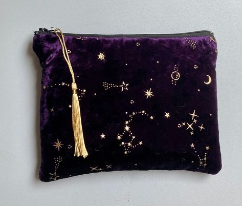 Purple Crushed Velvet Make Up Bag / Pouch / Purse This is a beautiful to touch silky velvet slouchy bag with gold stars, moon and sun embellished details.  The bag is lightly padded and fully lined with 100% cotton black fabric.  There is a contrasting black fabric zip.  It is perfect for holding cosmetics or to be used as a purse or clutch. Measures approx 8 inches wide and 6 inches deep. Pattern placement may vary slightly as each bag is individually handmade by me in the UK. Please note that Bee Makeup, Velvet Purple, Black Clutch Bags, Purple Star, Velvet Purse, Slouchy Bag, Velvet Clutch, Pouch Purse, Stars Moon