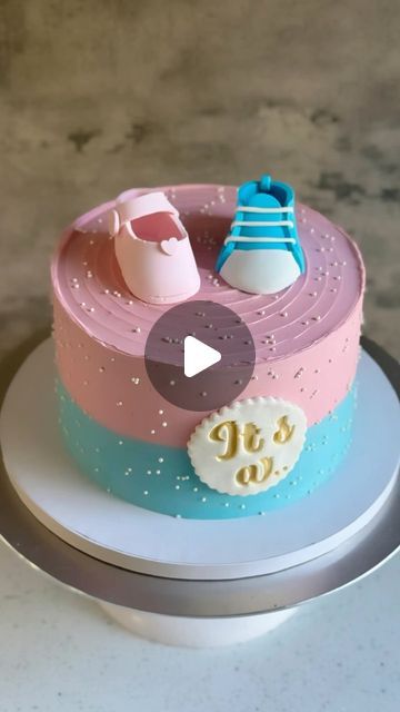 Ankita Dutta | CAKE ARTIST on Instagram: "Gender reveal cake! 💗💙 I’d already made one of these a few months ago. I always enjoy this style — it’s simple, but effective. So satisfying to seal up the secret inside — and such a great reveal when you cut into it! The cake is eggless chocolate, with chocolate buttercream between the layers (and *pink* candy within). All decorations are made of fondant, and 100% edible. Aren’t the shoes super cute ☺️ #genderrevealcake #genderrevealcakes #egglesscakes #egglesscake #egglessbaking #egglessbakes #cakeideas #cakeartist #cakedecorator #cakecakecake #cakedesigner #buttercreamcakedesign #cakereels #cakereel #cakereelsofinstagram #cakereelsvideo #cakesgram #cakeinstagram #fremontbaker #bayareabaker #bayareacakes #instacakers #instacakedesign #naanba Desserts Gender Reveal, Gender Reveal Chocolate, How To Make A Gender Reveal Cake, Baby Gender Reveal Cake Ideas, Cake Reveal Gender Ideas, Baby Shower Cake Designs Simple, Minimalist Gender Reveal Cake, Simple Baby Shower Cake Ideas, Gender Reveal Sheet Cake