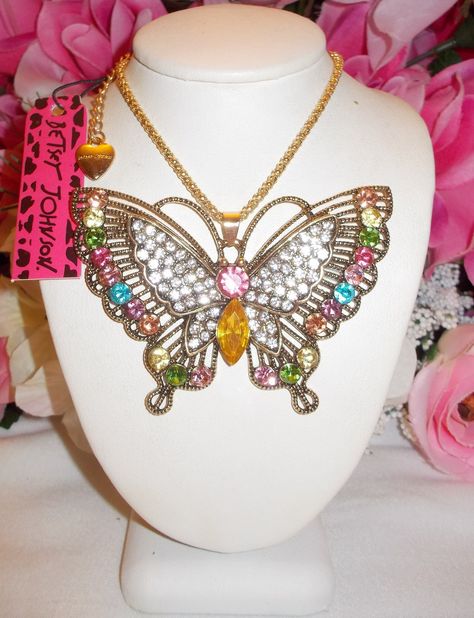 Lovely multicolor long yellow gold plated chain crystal inlay butterfly pendant necklace design by Betsey Johnson.  the pendant is 2 inches in height and 2.9 inches in width.  the chain is approximately 27 inches in length and has a lobster claw clasp closure with sighed logo charm in place.  The item is new with tags.  Lovely to wear, gift or add to a collection.  Thanks for stopping by today. Handmade Whimsical Butterfly Necklace, Nature-inspired Necklace With Butterfly Charm, Angel Wings Necklace Betsey Johnson, Crystal Butterfly Charm Necklace, Multicolor Butterfly Charm Necklaces, Dope Jewelry Accessories, Butterfly Pendant Necklace, Betsey Johnson Jewelry, Steampunk Accessories