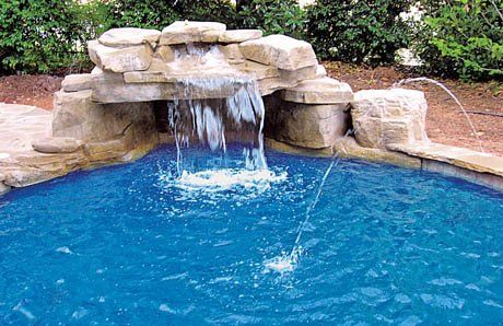 Ten affordable swimming pool grotto designs—in pictures—for your backyard Rock Around Pool, Pool Grotto Ideas, Pool Waterfall Landscaping, Pool Waterfall Ideas, Pool Grotto, Cement Pond, Grotto Design, Grotto Pool, Pool Waterfalls