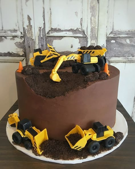 Construction Cake | Construction Birthday Cake  Chocolate and construction - what a perfect pair! This cake featured our chocolate cake, filled with white chocolate mousse and frosted in ganache. The cake was finished with what else but Oreo crumbs and cake truffles (disguised as rocks). Happy birthday Bulldozer Cake, Construction Birthday Party Cakes, Digger Cake, Construction Birthday Cake, Construction Theme Birthday, Construction Theme Birthday Party, Construction Cake, Truck Cakes, White Chocolate Mousse