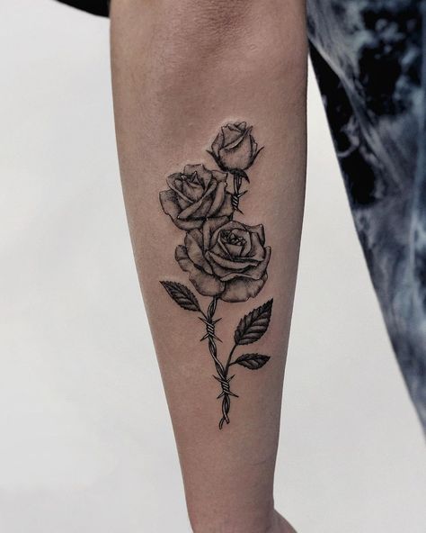 Tattoo of roses with barbed wire stem. Black and grey, detailed, fineline, microrealism tattoo. Rose And Barbed Wire, Barbed Wire Tattoo, Wire Tattoo, Rose Tattoo Stencil, Barbed Wire Tattoos, Rose Tattoo Meaning, Rose Hand Tattoo, Rose Tattoos For Men, Omerta Tattoo