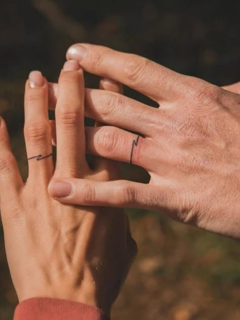 Ditch the Rings: 21+ Badass Wedding Ring Tattoos That Say “Forever" Female Wedding Band Tattoo, Unique Wedding Ring Tattoos For Couples, Men’s Tattoo On Ring Finger, Women Ring Tattoo, Wedding Ring Tattoos Men, Ring Tattoo Designs For Couples, Engagement Tattoos Finger, Male Ring Tattoo, Men’s Ring Tattoo Designs