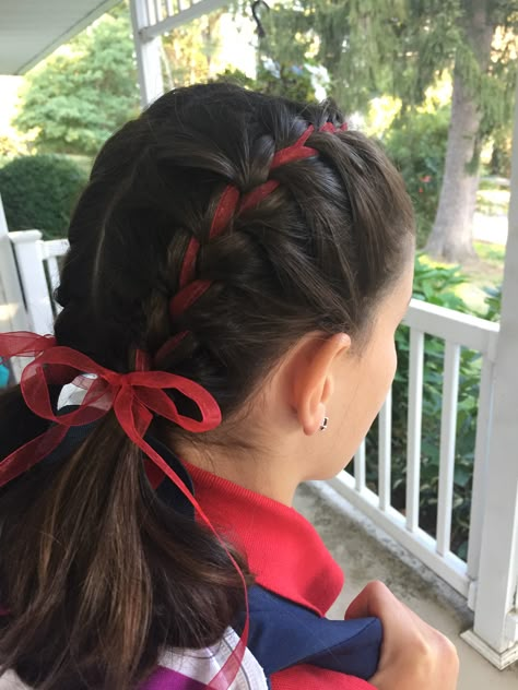 Double Dutch half braids into ponies with organza ribbon Fun Hairstyles With Ribbon, Ribbon Pigtail Braids, Double Braids With Ribbon, Hairstyles With Red Accessories, Braided With Ribbon, Hair Braided With Ribbon, Low Pigtails With Ribbon, Puffy Dutch Braids, Game Day Hairstyles With Ribbon