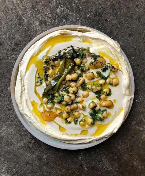 Yotam Ottolenghi on Instagram: “Hummus (with jarred chickpeas, not fresh, but don’t tell anyone 🤫) made with confit garlic. Deliciously tasting. #testkitchen” Ottolenghi Hummus, Ottolenghi Tomato Salad, Ottolenghi Vegetarian Dinners, Ottolenghi Sweet Potato Recipes, Ottolenghi Flavour, Loaded Hummus, Confit Garlic, Whats Gaby Cooking, Yotam Ottolenghi