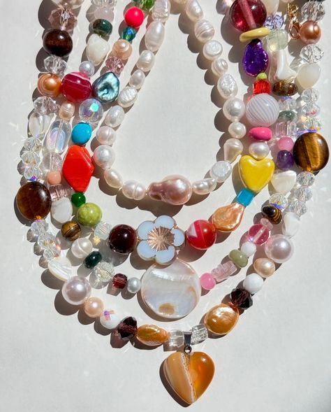 Once in a while we make random, limited things we love at our New York studio ⭐️ Fixing our sweet tooth with these 𝓞𝖗𝖌𝖆𝖓𝖎𝖈 BONBON Candy Necklaces..🤤🍬🌈 This special one-off drop is handmade with all semi-precious and precious stones such as natural agates, tiger’s eye gemstone, mother of pearls, and vintage glass beads we collect over the years🌞 naturally limited quantities for these healthy “sweets” 😆 all measure at approximately 16” long. Clutter Necklace Y2k, Chunky Bead Necklaces Aesthetic, Cool Pearl Necklace, Colorful Necklace Stack, Cool Beaded Necklaces, Maxamilist Jewelry, Glass Beaded Necklace, Hsr Redesign, Craft Moodboard