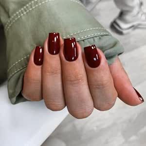 this product is a 24-piece set of wine red press-on nails with a short to medium square shape. They can be applied with adhesive or pressed on and are suitable for the fall and winter seasons. They are reusable and intended for women who desire a stylish and convenient manicure option. Short Coffin Acrylic Nails, Nails Short Medium, Dark Color Nails, Coffin Acrylic Nails, Red Gel Nails, Dark Red Nails, Wine Nails, Maroon Nails, Press On Nails Short