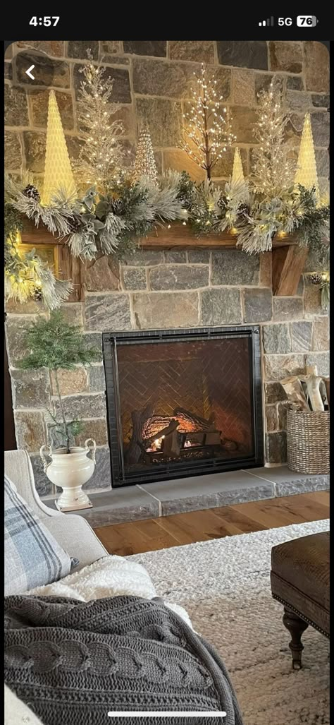 Wood Mantle Christmas Decor, Tree By Fireplace Christmas, Simple Christmas Mantle Stone, Rock Fireplace Christmas Decor, Christmas Mantle With Small Trees, Country Christmas Mantle Ideas, Christmas Mantle Trees, Christmas Tree Fireplace Decor, Decorating Fireplace Mantel For Christmas