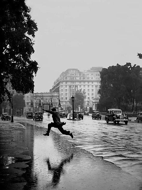 Here's a photo that you may not know. The photograph is 'Leap of Faith' by J A Hampton on a rainy day in Hyde Park in 1939. It's reviewed in detail by Ashleigh Mahoney in Camera Historica. The photograph captures the tension of the moment when a pedestrian attempts to jump over a large puddle. It has all… Ballerina Poster, Forest Poster, Hyde Park London, Batman Poster, New York Poster, Roger Moore, Slim Aarons, Poster Store, Poster Photo