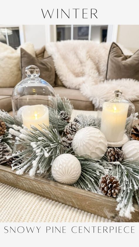 Janine Graff | Snowy Pine Centerpiece ❄️captures the essence of the winter season. I adore the soft glow of candlelight. It’s a challenge to maintain that... | Instagram January Dining Table Centerpieces, Snowy Centerpiece Ideas, Winter Decor Centerpiece, Simple Winter Table Centerpieces, Snow Centerpieces, Winter Tablescape Ideas, Winter Candle Centerpieces, Snowman Centerpiece Ideas, Winter Wonderland Centerpieces Diy