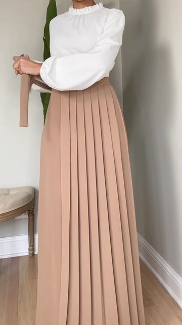 Beige Pleated Full-length Bottoms, Elegant Bottoms With Lined Skirt And Wide Hem, Elegant Flowy Maxi Skirt With Wide Hem, Elegant Pleated Solid Culottes, High-waisted Pleated Work Skirt, Modest Pleated Flowy Skirt, Relaxed Maxi Skirt With Pleated Wide Hem, Chic Pleated Bottoms With Wide Hem, Elegant Beige Pleated Maxi Skirt