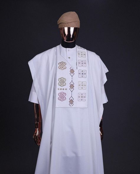 A white, connected square & renaissance maze embrodery details agbada, mixed Swarovski buttons on 3/4 sleeve kaftan & sokoto

What you get:

Agbada
Kaftan men’s top
Pant trousers

Price - available on website

To order:

iMessage, Text or WhatsApp : +2348179435662
+2239179435663
Email: info@dejiandkola.com
Website: dejiandkola.com White Agbada Styles Men, Agbada Lace, Agbada Styles Men Wedding, White Agbada Designs, Agbada Styles Men, White Agbada, Coco Costume, Agbada For Men, Mens Kaftan