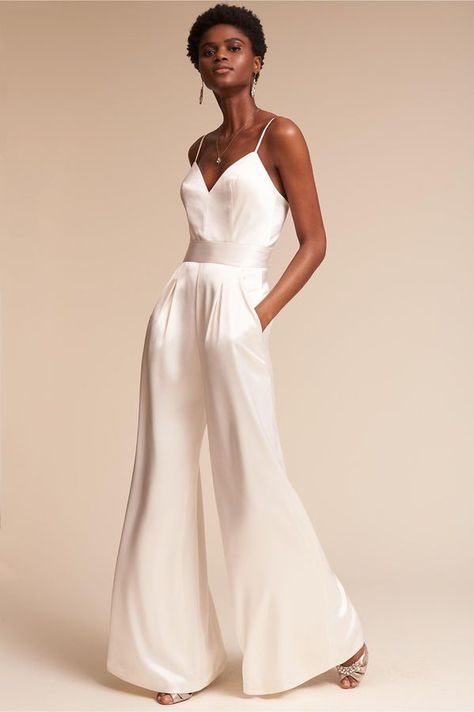 White silk jumpsuit! Perfect for the modern bride! Love this for a wedding reception! Bridal Jumpsuit The Bride, Wedding Reception Outfit For Bride, Reception Outfit For Bride, Jumpsuit Wedding Dress, Bride Jumpsuit, Wedding Reception Outfit, Wedding Pantsuit, Wedding Pants, Rehearsal Dinner Outfits