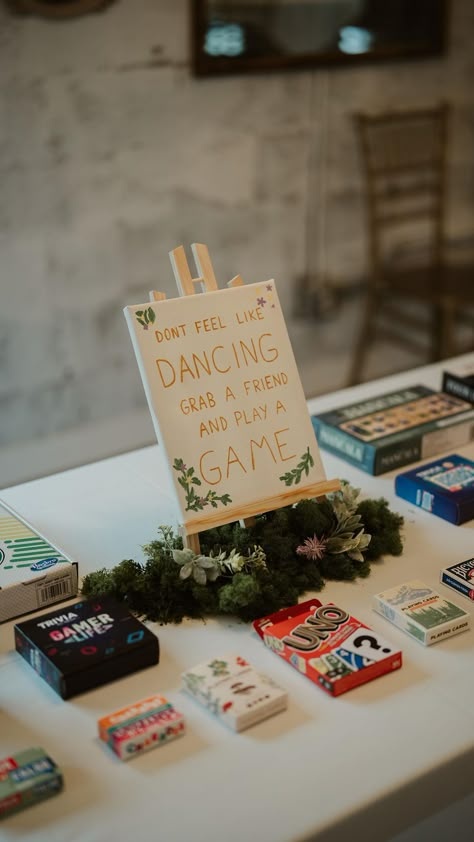 At the wedding I got to photograph this past Friday, I saw this table set up and LOVED the idea! I’ve heard from so many people that they… | Instagram Wedding Ideas For Entertainment, Wedding Fun Things, Game Table For Wedding, Wedding In The Round, Activities For Guests At Wedding, Card Table At Wedding, Diy Wedding Set Up, Wedding Activity Table, Wedding Day Ideas Fun