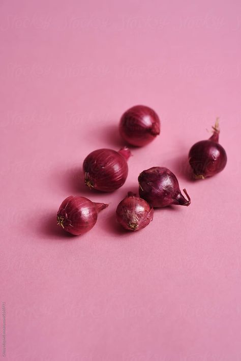 several red pearl onions on a pink background Onion Pink, Pearl Onions, Red Pearl, Tiny Things, Pink Background, Food Styling, Onions, Red, Pink