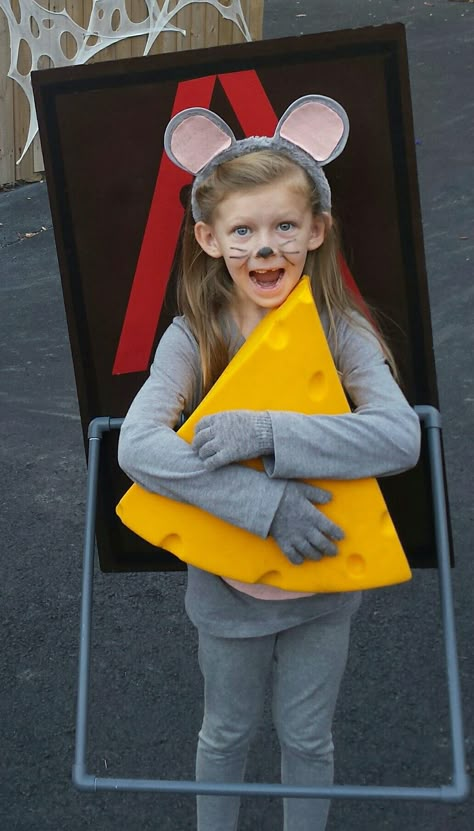 Mousetrap costume. made it with foam board with brown spray paint and red tape, pvc piping with gray spray paint for the trap bar, I bent 2 metal hangers for the strap to hold it on her back, cheese hat and grey clothes and ears. Easy costume to make and Emily won 1st place in 3 different contest. Diy Mouse Costume, Mouse Diy Costume, Kids Mouse Costume, Mouse Costume Diy, Brown Spray Paint, Easy Costumes To Make, Cheese Costume, World Book Day Outfits, Kids Dress Up Costumes