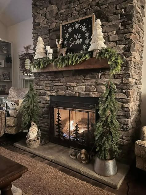 Tree By Fireplace Christmas, Farm Curb Appeal, Rustic Cabin Mantle Decor, Stone Fireplace Insert, Christmas Mantel Decorating Ideas 2022, Rustic Fireplace Christmas Decor, Christmas Tree Fireplace Decor, Christmas Trees On Each Side Of Fireplace, Country Christmas Mantle Ideas