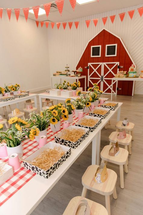 This birthday party exuded the farm theme to a tee. The blank raw space had a large red farm barn door installation, yellow sunflowers that lined each petite table and sweet treats in the shape of animals. The intricate details provided by Evoke Design and Creative made this party sensational, right down to the hay bale decor. Farm Baby Birthday, Hay Bale Decor, Barn Birthday Party, Farmyard Party, Farm Party Decorations, Animal Themed Birthday Party, Animal Theme Birthday, Farm Themed Party, Barnyard Birthday Party