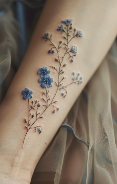 The Beauty and Significance of the Forget Me Not Flower Tattoo Flower Tattoos Colorful, Delicate Wildflower Tattoo, Tattoo Flowers Color, Colorful Tattoos For Women, Color Flower Tattoo, Forget Me Not Flower Tattoo, Blue Flower Tattoos, Forget Me Not Tattoo, Pretty Flower Tattoos