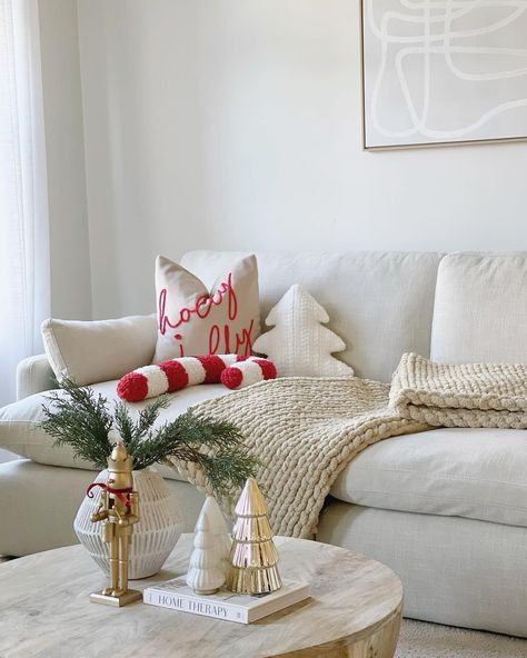 New Year Living Room Decor, Red White And Brown Christmas Decor, White Couch Christmas Decor, Studio Apartment Christmas Decor Ideas, Pop Of Red Christmas Decor, Beige And Red Christmas Decor, Red And Neutral Christmas Decor, Neutral Red And Green Christmas, Christmas Living Room Ideas Apartment